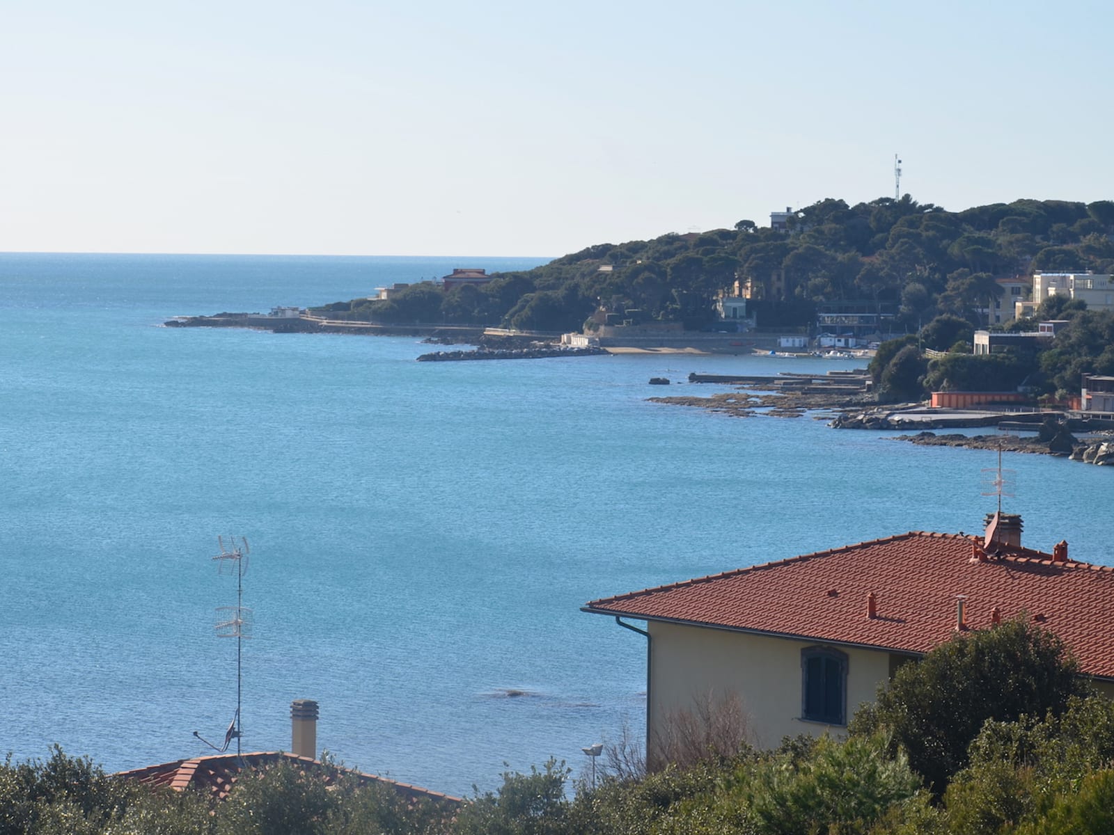 Balcony view toward the harbor and Tuscan coast