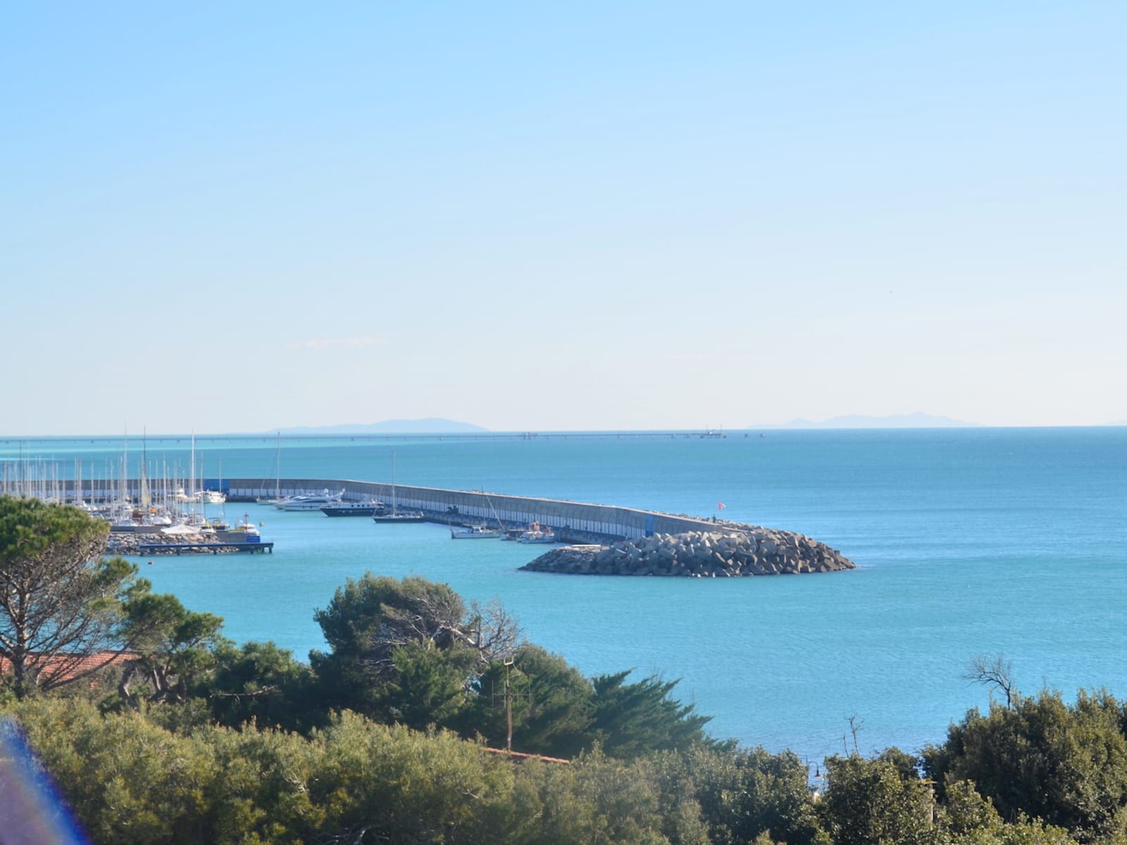 Blue sea and harbor in Castiglioncello